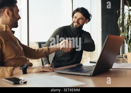 Two Men Shaking Hands In Office, Business Meeting, Corporate Success Concept Stock Photo