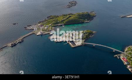 Aerial view of the Lofoten landscape featuring a winding coastal road ...