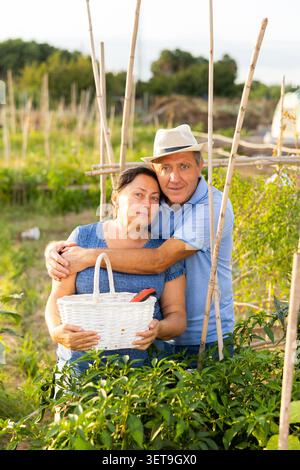 Cute senior couple in backyard garden Stock Photo