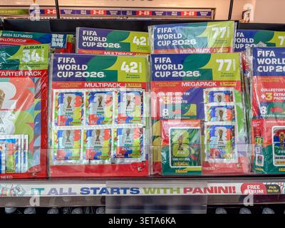 Panini FIFA World Cup 2026 sticker multipacks and collector tins displayed on a retail shelf for purchase by football fans. Stock Photo