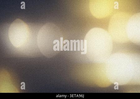 Golden bokeh that creates an abstract pattern with blurred light and a grainy texture Stock Photo