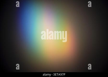 Abstract colored light that creates a blurry color gradient against a dark background Stock Photo
