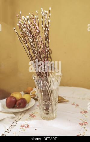 Crystal vase with willow twigs for Easter Sunday decoration. Concept of seasonal floral arrangement, arrival of spring, and elegant holiday still life Stock Photo