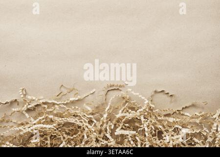 Kraft paper background with natural, shredded packaging material as a copy template Stock Photo