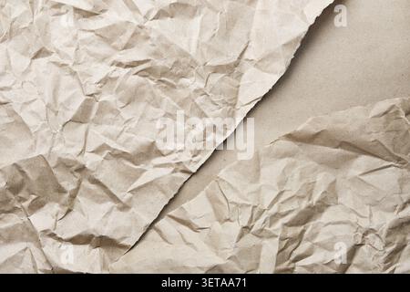Wrinkled textured brown kraft paper background Stock Photo