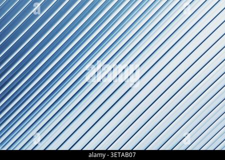 Blue striped ribbed glass background, diagonal abstract texture Stock Photo