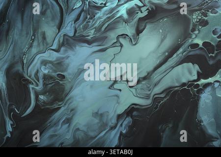Liquid art. Green abstract wave vortices on black background. background or texture with marble effect Stock Photo