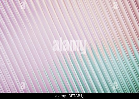 Abstract corrugated glass with pastel color gradient with diagonal lines in pink and green Stock Photo