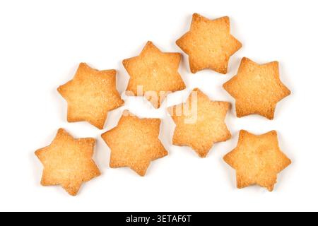 Lots of star-shaped cookies on a white background. Shortbread cookies on a white background. Stock Photo