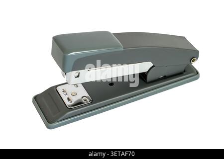 Hand stapler for stapling papers on a white background. Modern stationery stapler close-up. Stock Photo