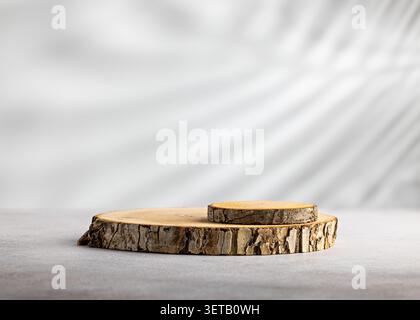 Two level wood slice podium with small raised stump on soft white background for natural product display mockup Stock Photo