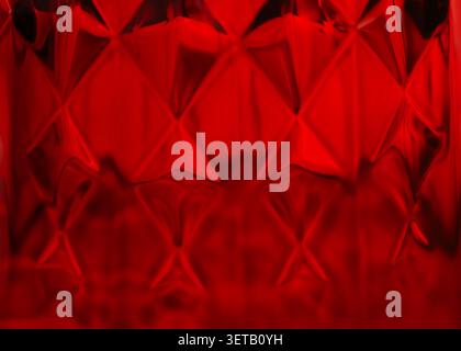 Abstract Red Glass Texture with Geometric Pattern and Diamond-Shaped Designs Stock Photo