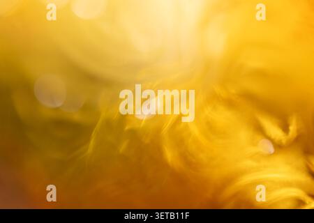 Abstract Golden Light Bokeh Background with Blurred Swirls and Warm Tones Stock Photo
