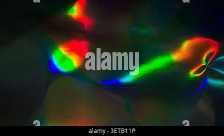 Vibrant Abstract Holographic Light Reflections on Dark Surface Stock Photo