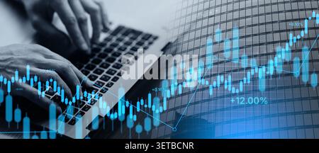 Business man using laptop sitting at desk in office Stock Photo