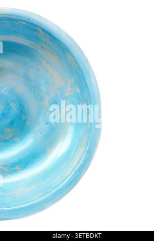 Half of light blue craft ceramic plate isolated on white background closeup Stock Photo