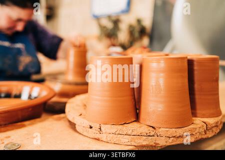 Handcrafting traditional terracotta pottery in a ceramic workshop Stock Photo