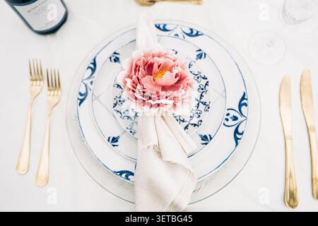 Elegant table setting with white and blue patterned plates Stock Photo