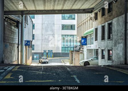 Q-Park Stephens Green car park entrance with a white Tesla exiting in Dublin city centre Ireland Stock Photo