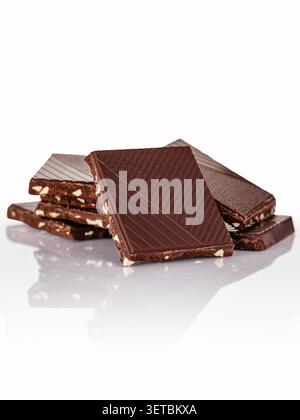 Delicious stack of dark almond chocolate squares Stock Photo
