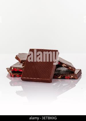 Artisan dark chocolate pieces with dried berries Stock Photo