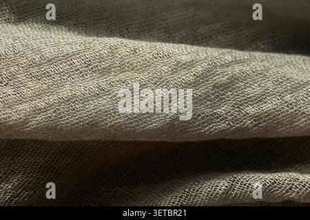 Detailed close-up of a woven metallic grid with realistic texture and deep shadows Stock Photo