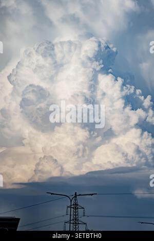 Large textured cumulus congestus cloud building up in the summer air, emphasizing themes of environmental science, weather forecasting, and nature Stock Photo