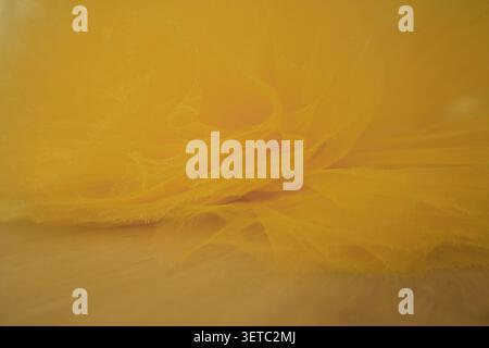 Yellow natural vibrant linen textile background. Top view. Flat lay, copy space. Abstract orange fabric cloth background Stock Photo