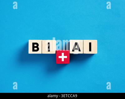 Wooden blocks forming BI plus AI on blue background, representing the integration of business intelligence and artificial intelligence Stock Photo