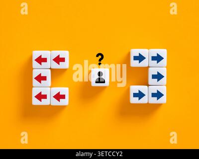 Person facing a dilemma, choosing between two opposing paths. Making a decision on the correct direction for the future Stock Photo