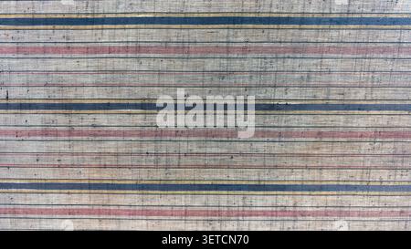 The old fabric background has a patterned, textured surface resembling cloth. Stock Photo