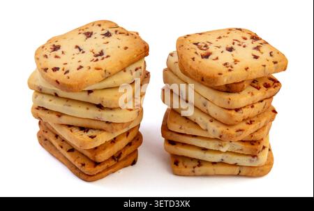A heap of rectangular cranberry butter cookies with dried fruit bits scattered on a white background. Stock Photo