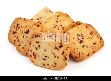 A heap of rectangular cranberry butter cookies with dried fruit bits scattered on a white background. Stock Photo