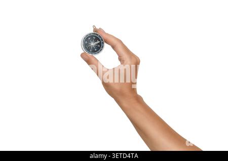 Woman's hand holds compass on white background. Guidance and exploration of natural environment, travel, tourism. Stock Photo