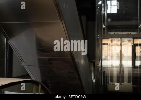 A minimalist view of sleek metal structures and glass panels creating a professional urban atmosphere Stock Photo