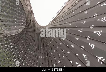 Chongqing, China - 8 Jun 2026 - The composition of dominated by a sweeping arrangement of metallic, monochromatic ribs that converge and fan outward w Stock Photo
