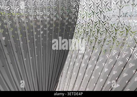 Chongqing, China - 8 Jun 2026 - Featuring an intricate, fan-like geometry, the sculpture relies on a central, sinuous partition that gracefully divide Stock Photo