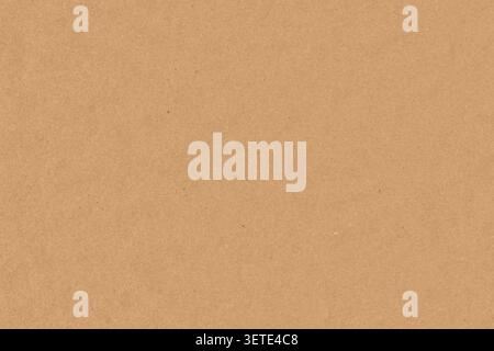 Close up background texture of brown kraft paper sheet or recycled cardboard packaging. Clean empty kraft paper surface for eco friendly design mockup Stock Photo