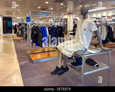 Male mannequin wearing luxury casual fashion in Harvey Nichols Edinburgh, St Andrew Square. High-end retail interior with clothing rails. Stock Photo