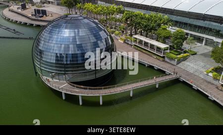 Futuristic spherical glass building floating on water in Singapur Stock Photo