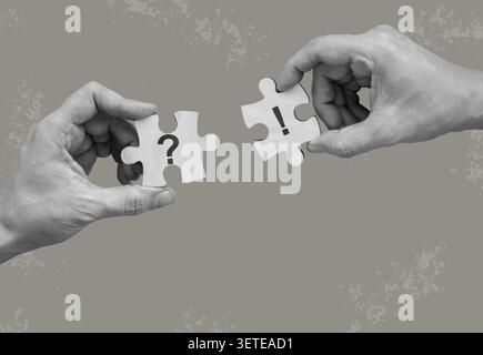 Question and exclamation puzzle piece held by hands for problem solving. Stock Photo