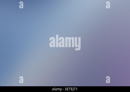 Soft light blending blue and purple colors with subtle grain texture creating an atmospheric background Stock Photo