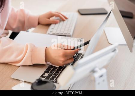 Female programmers hands testing code on laptop in office, closeup Stock Photo