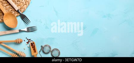 Kitchen utensils and tea infuser on blue textured background with copy space Stock Photo