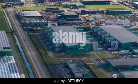Aerial view of a massive hyperscale data center campus supporting cloud computing, big data, artificial intelligence and digital infrastructure. Stock Photo