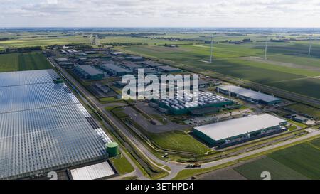 Aerial view of a massive hyperscale data center campus supporting cloud computing, big data, artificial intelligence and digital infrastructure. Stock Photo