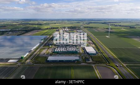 Aerial view of a massive hyperscale data center campus supporting cloud computing, big data, artificial intelligence and digital infrastructure. Stock Photo