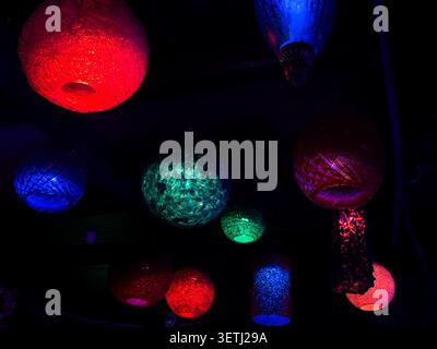 A view of glowing lanterns in the darkness. Stock Photo