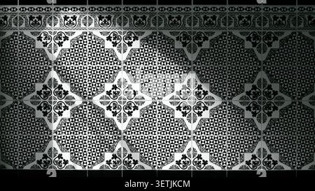 A detailed view of a black and white ceramic wall featuring repeating floral motifs and geometric triangles creating a sophisticated, vintage, archite Stock Photo