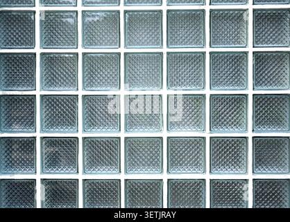 Wall with rows of glass bricks or blocks as texture or background Stock Photo